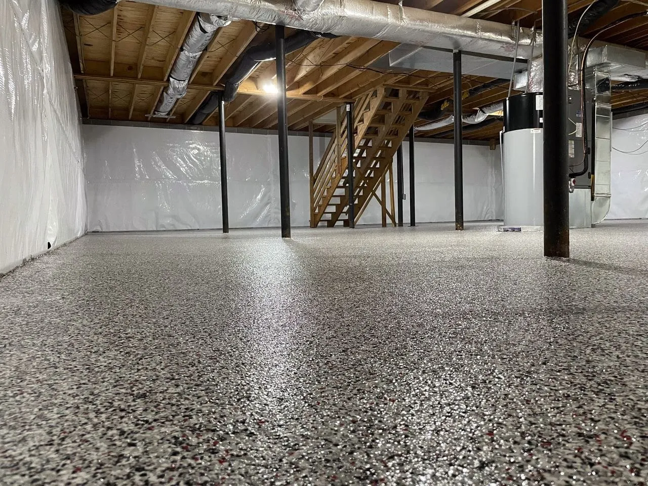 Decorative flake epoxy installed in an unfinished basement showing the durable Pure Reflection finish