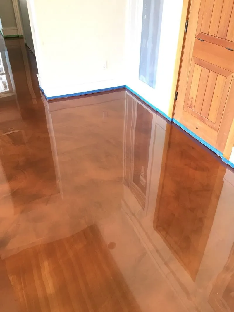 Custom-color copper metallic epoxy floor poured in a Tri-Cities home